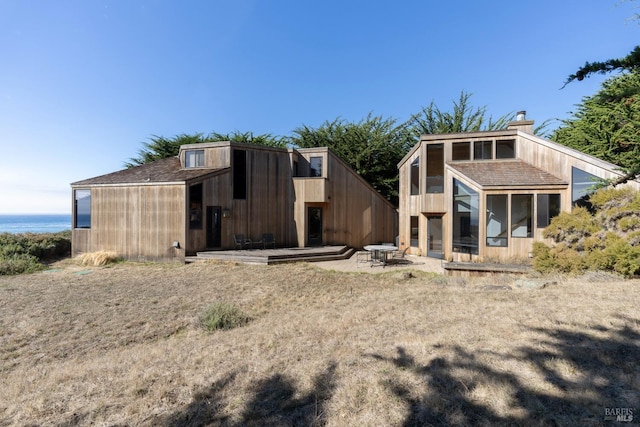 rear view of property featuring a patio area