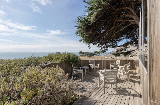 wooden deck featuring a water view