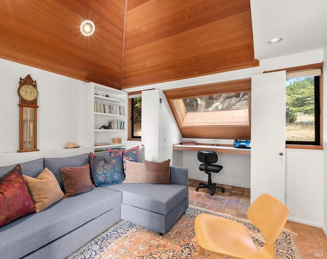 living room featuring wood ceiling, built in desk, and vaulted ceiling