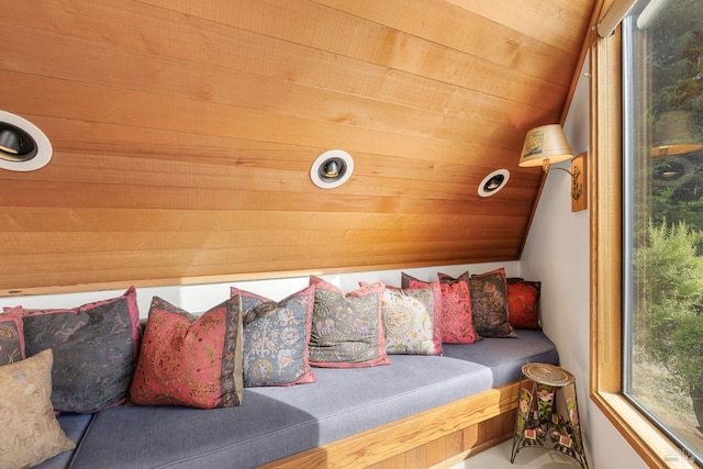 sitting room featuring wood ceiling and vaulted ceiling