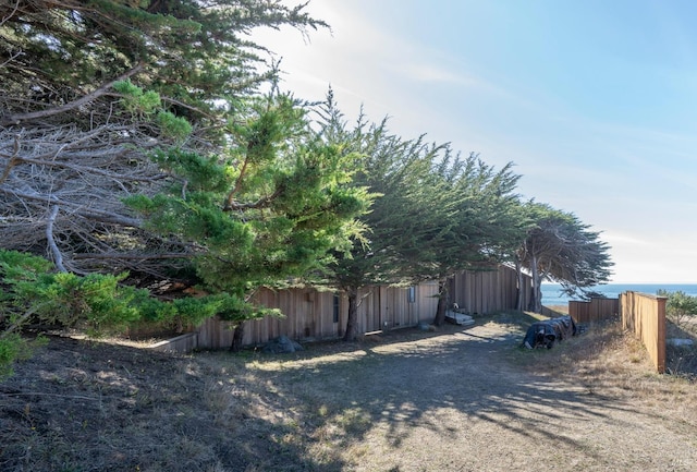 view of property exterior with a water view