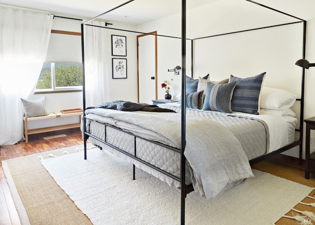 bedroom with wood finished floors