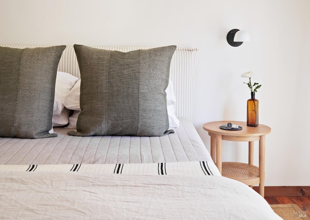 bedroom featuring wood finished floors