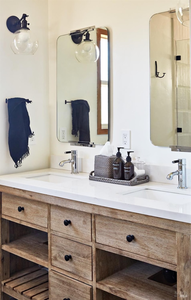 bathroom featuring double vanity and a sink