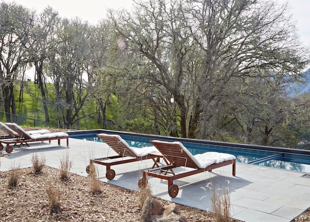 outdoor pool with a patio