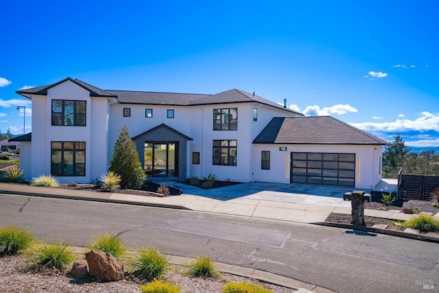 modern inspired farmhouse featuring a garage