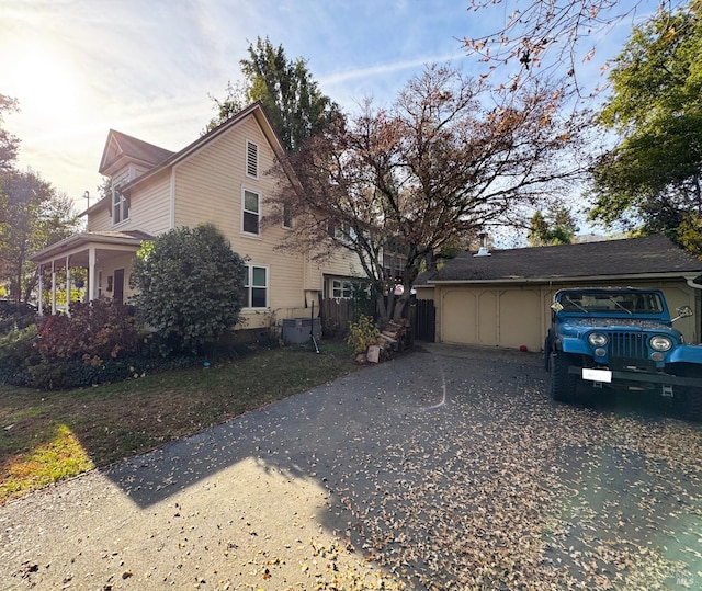 view of side of home with fence