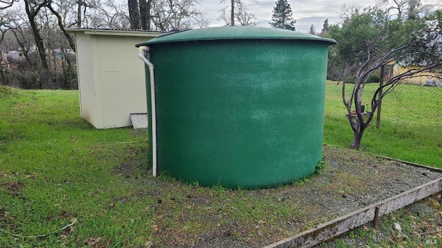 view of outbuilding with a yard