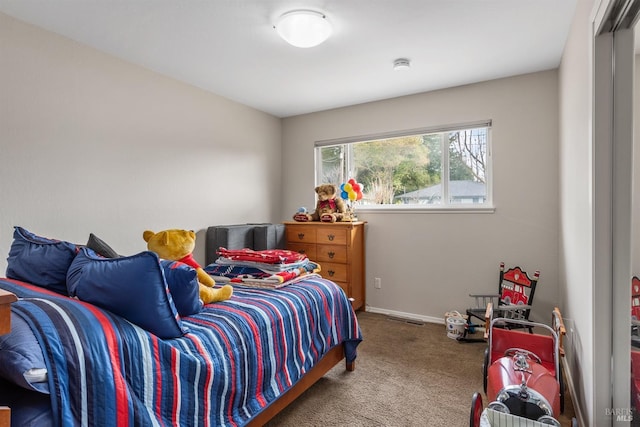 bedroom with baseboards, visible vents, and carpet flooring