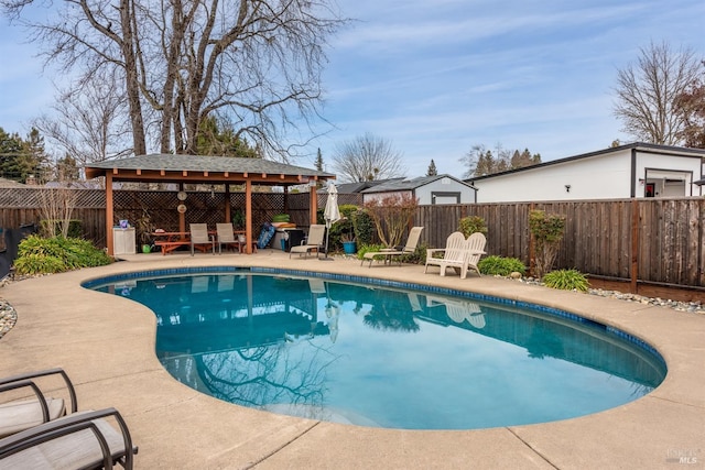 view of pool with a patio, a fenced in pool, a fenced backyard, and a gazebo