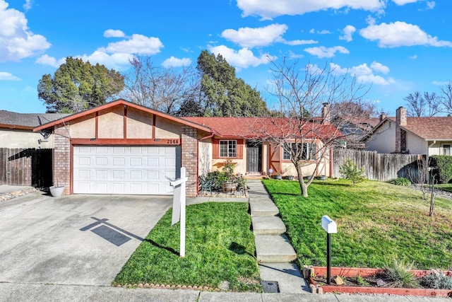 ranch-style house with a garage and a front yard