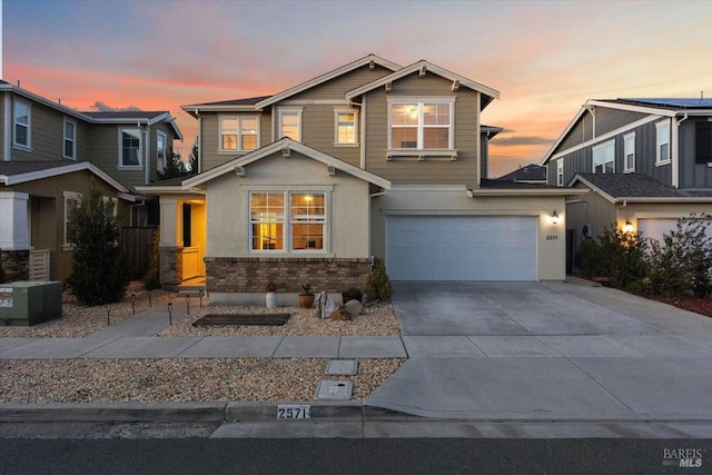 craftsman house with a garage