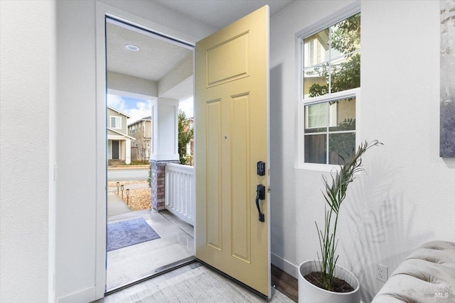 doorway to outside with light wood-type flooring