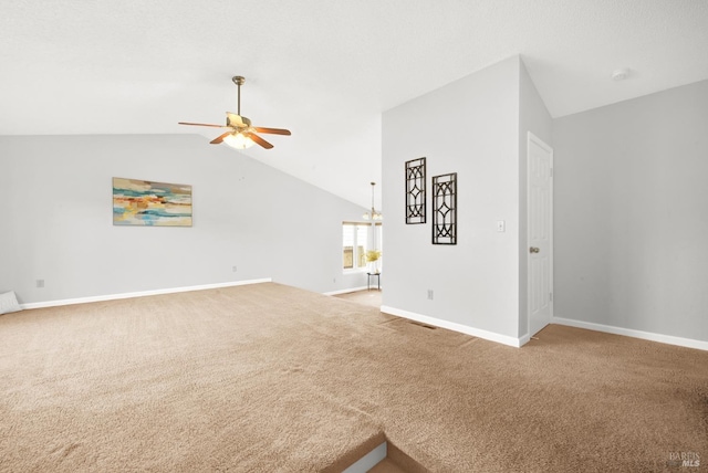 unfurnished living room featuring lofted ceiling, carpet floors, and ceiling fan with notable chandelier