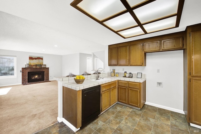 kitchen with sink, black dishwasher, dark colored carpet, tile countertops, and kitchen peninsula