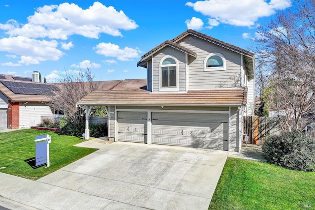 view of front of home featuring a garage and a front yard