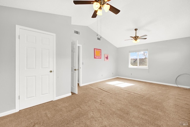 unfurnished room featuring lofted ceiling, carpet floors, and ceiling fan