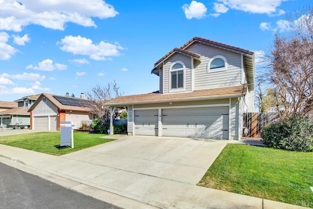 view of front of property with a garage and a front yard