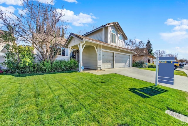 view of front facade with a garage and a front lawn