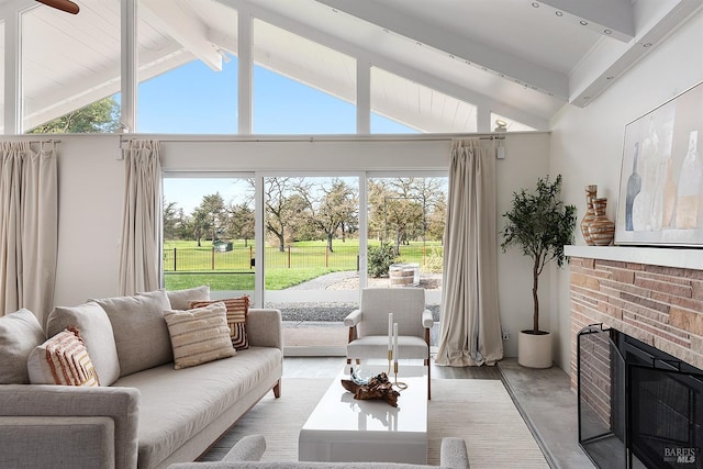 sunroom / solarium featuring a fireplace and lofted ceiling with beams