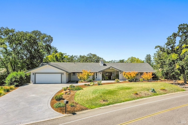 single story home featuring a garage and a front yard