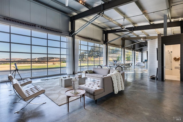 sunroom / solarium featuring a mountain view