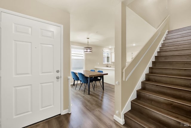 foyer featuring wood-type flooring and sink