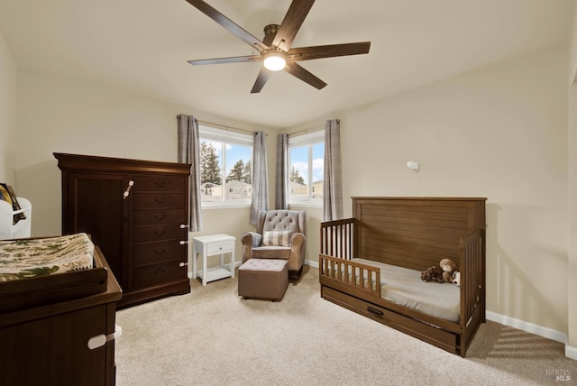 carpeted bedroom with ceiling fan