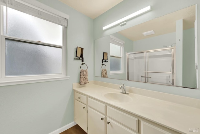 bathroom featuring vanity and walk in shower