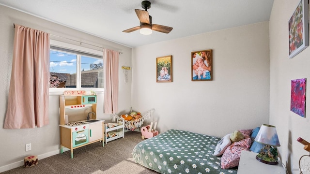 bedroom featuring a ceiling fan, carpet flooring, and baseboards