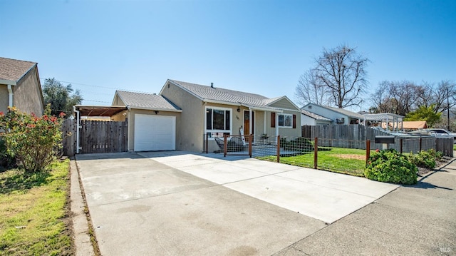 single story home with a fenced front yard, concrete driveway, a garage, and stucco siding