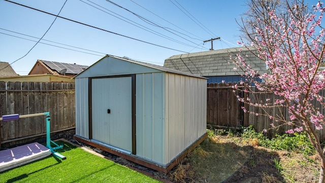 view of shed featuring a fenced backyard