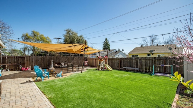 view of yard with a patio area and a fenced backyard