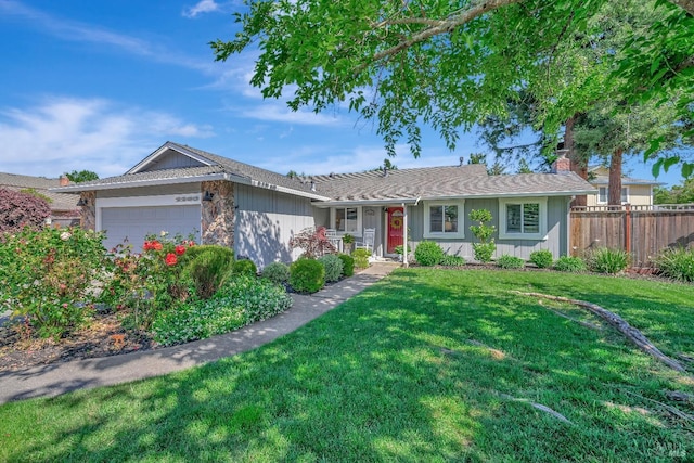 single story home with a garage and a front lawn