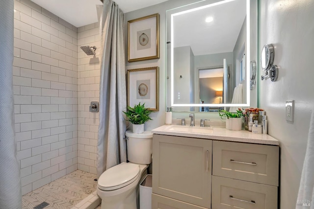 bathroom with a shower with curtain, vanity, and toilet