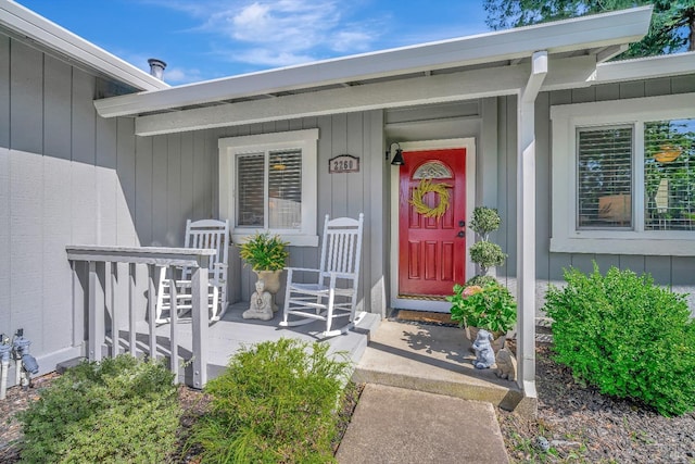 doorway to property with a porch