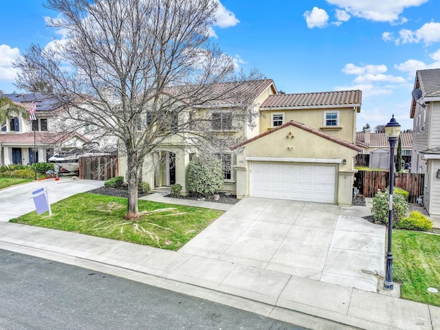 mediterranean / spanish home with a front yard