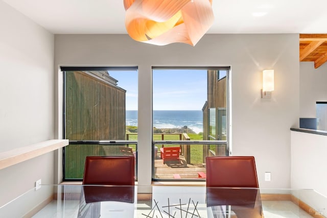 dining area featuring a water view