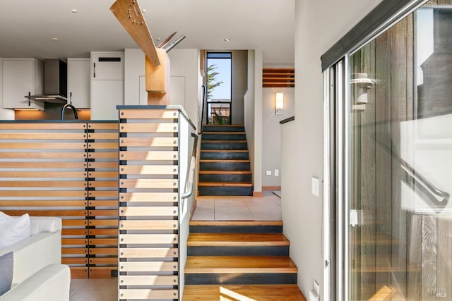 staircase with tile patterned floors