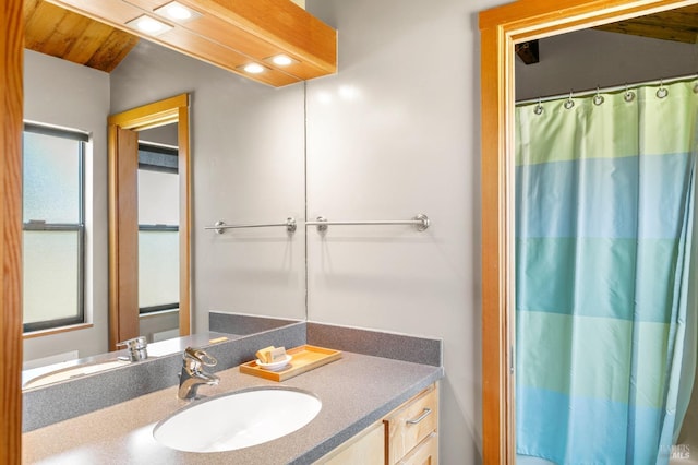 bathroom with vanity and a shower with shower curtain