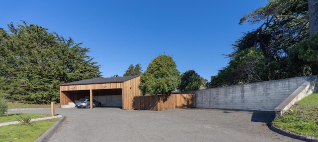 garage featuring a carport