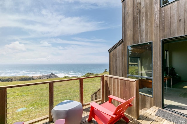 wooden deck featuring a water view