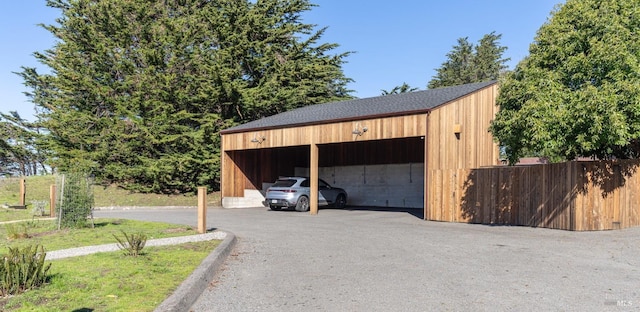 garage featuring a carport