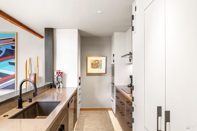 kitchen featuring sink, stainless steel appliances, and white cabinets