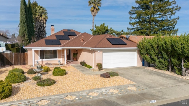 ranch-style home with an attached garage, fence, driveway, roof with shingles, and a chimney