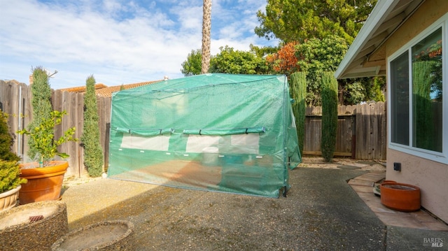 view of outdoor structure with a fenced backyard