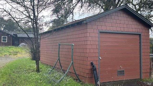 view of outbuilding with a garage