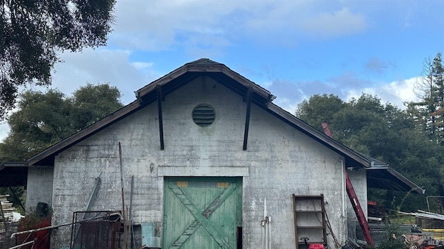 view of side of home with an outbuilding