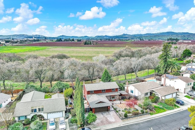 aerial view with a rural view, a residential view, and a mountain view