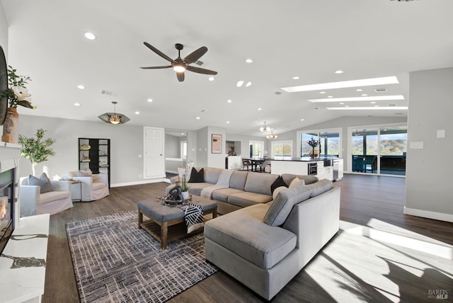 living room with lofted ceiling and dark hardwood / wood-style floors